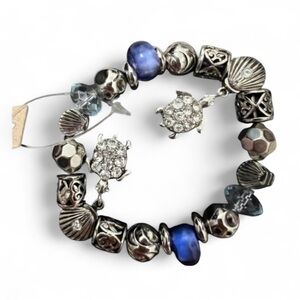 NWT Odri women’s silver tone charm stretch bracelet with blue beads